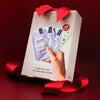 VOESH New York Mini Mani Set (10 pcs) on a dark red background with red ribbon bows