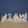 Art Angels back of die cut card with bunnies and  other wildlife in winter scene with space for handwritten note.