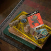 Lifestyle shot of Archivist Lion Matchbox (1 box) sitting on stack of book on coffee table