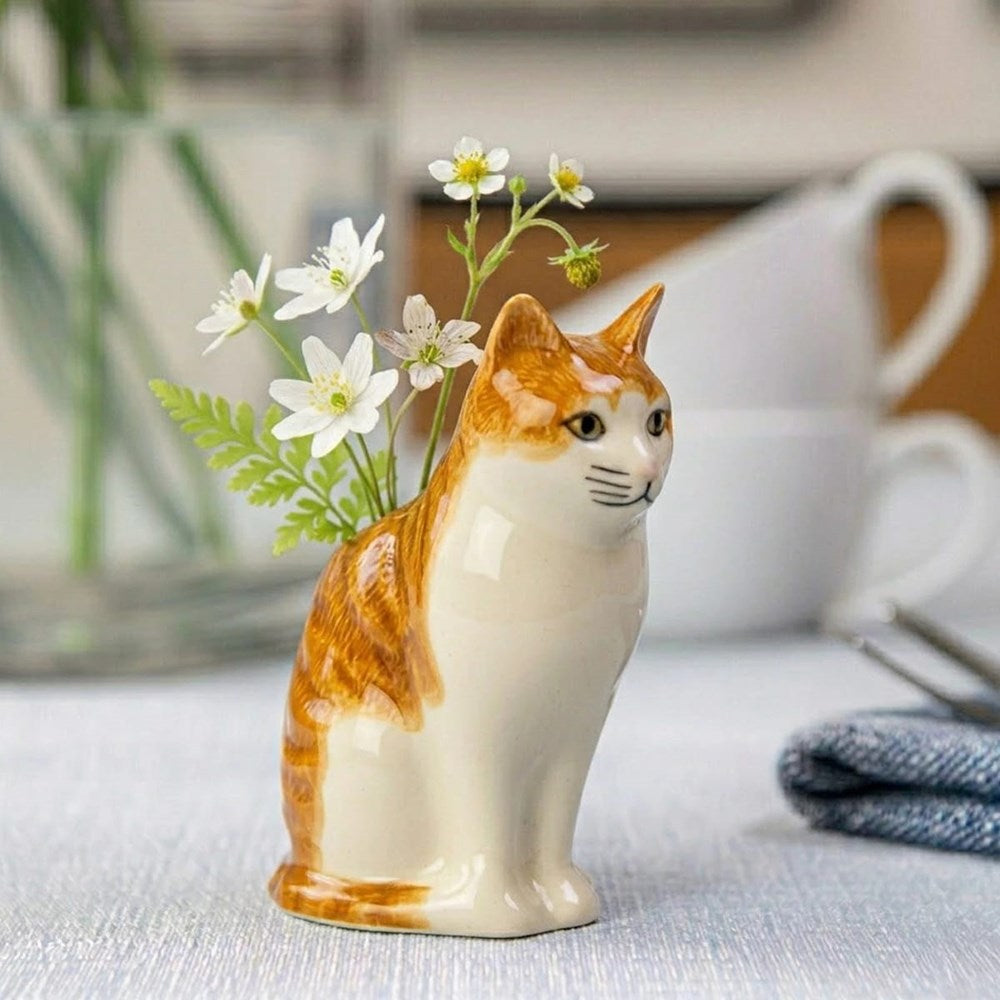 Lifestyle shot of Quail Ceramics Squash Bud Vase (1 pc) with white flowers in vase