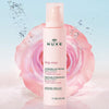 Nuxe Very Rose Make-up Remover Milk - product shown in front of rose with water splashing