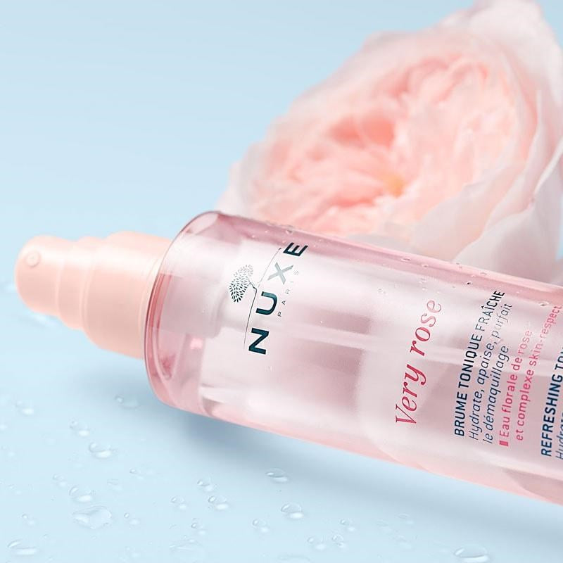 Nuxe Very Rose Refreshing Toning Mist - Closeup of product with flower in background
