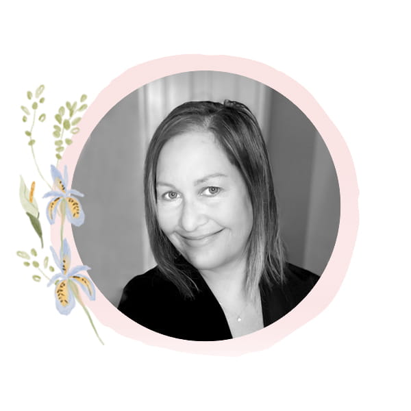 Headshot of Staff Member Kristy with seasonal art frame