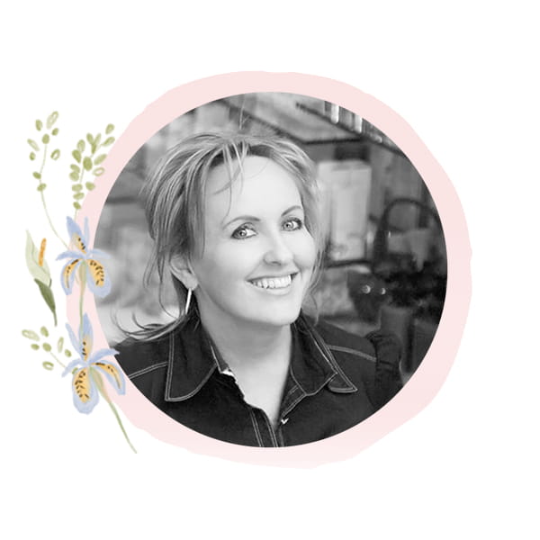 Headshot of Staff Member Paula with seasonal art frame