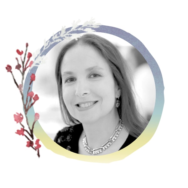 Headshot of Staff Member Karen with seasonal art frame