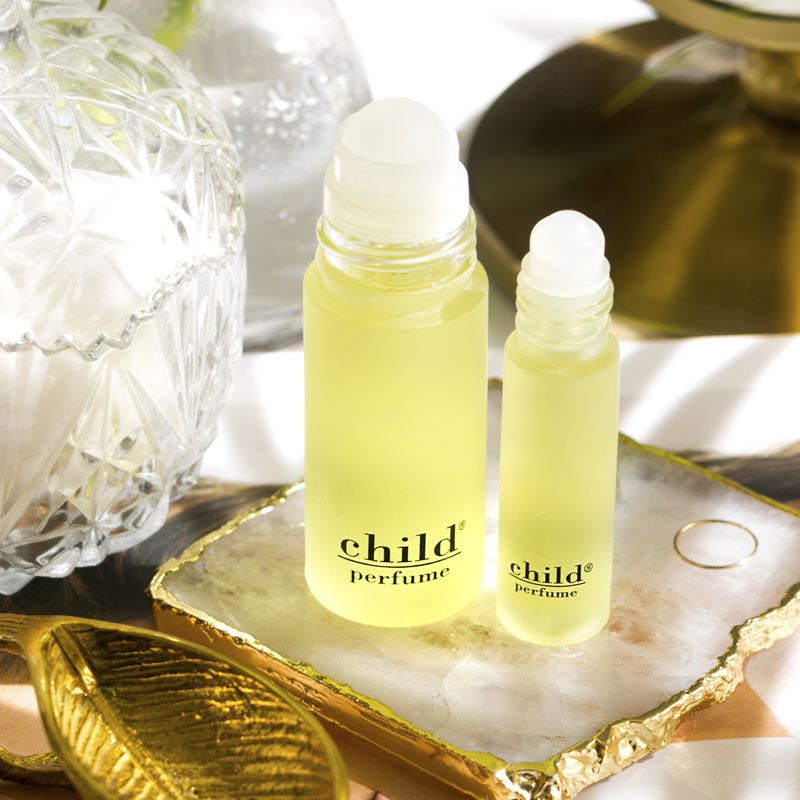 Child Perfume Roll On Lifestyle shot with both size bottles open