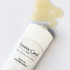Up close lifestyle shot top view of Leonor Greyl Bain TS Oily Hair Shampoo (200 ml) with swatch showing color and texture