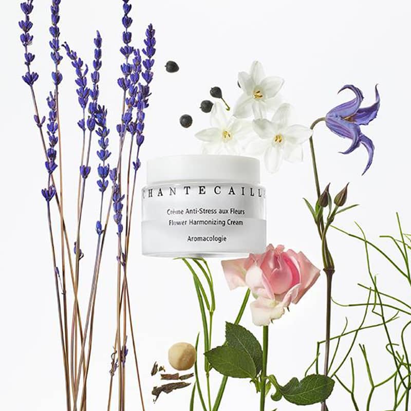 Beauty shot of Chantecaille Flower Harmonizing Cream (50 ml) with various flowers in the background
