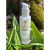Rahua by Amazon Beauty Rahua Omega 9 Hair Mask beauty shot in mossy area with plants and rocks