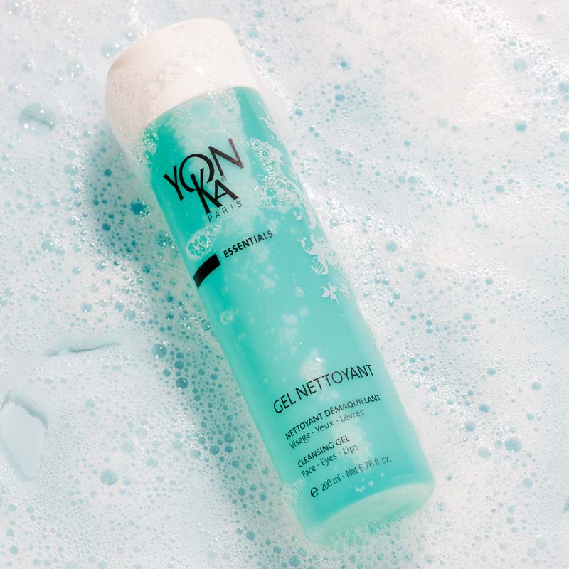 Lifestyle shot of Yon-Ka Paris Gel Nettoyant (200 ml) with soapy suds in the background
