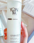 Model holding  Lotion Yon-Ka PNG Normal to Oily Skin Toner (200 ml)