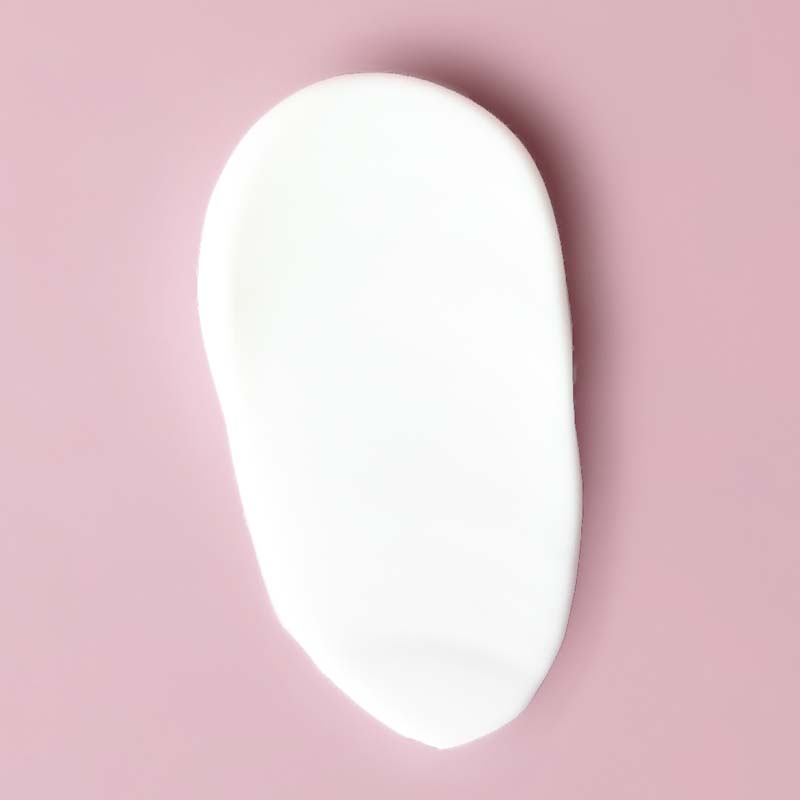 Yon-Ka Paris Phyto-Contour smear on pink background to show color and texture of product