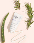 Yon-Ka Paris Phyto-Contour (15 ml) lifestyle shot of tube swatch and rosemary and aloe in the background