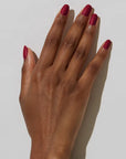 Model with dark skin tone wearing JINsoon Nail Lacquer - Coquette