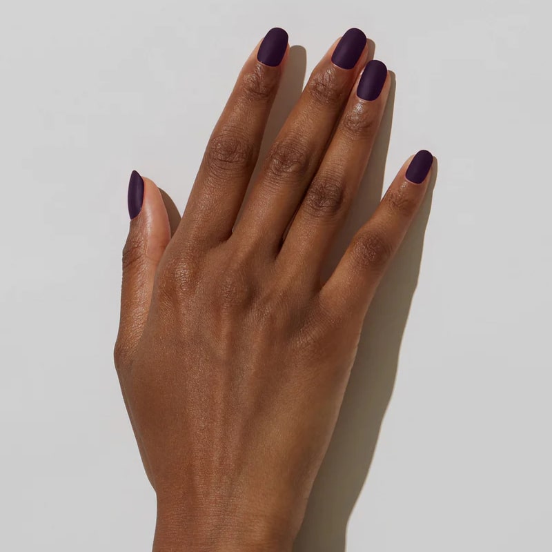 Model with dark skin tone wearing JINsoon Nail Lacquer - Risque