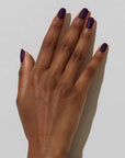 Model with dark skin tone wearing JINsoon Nail Lacquer - Risque
