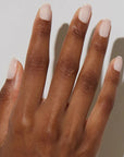Model with dark skin tone wearing JINsoon Nail Lacquer - Muse