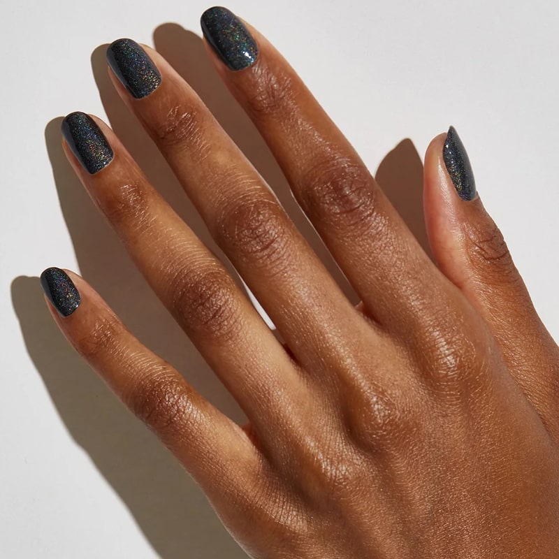 Model with dark skin tone wearing JINsoon Nail Lacquer - Mica