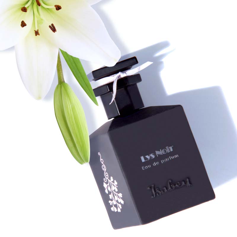 Isabey Paris Lys Noir Eau de Parfum (50 ml) with white lily flower in the background