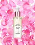Chantecaille Rose de Mai Face Oil 30 ml with pink rose petals in the background