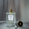 Beauty shot of ALTAIA Don't Cry For Me Eau de Parfum with cap off and water dripping down in the background
