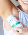 Model applying Ursa Major Hoppin' Fresh Deodorant - 2.6 oz under arm