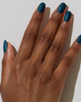 Model with dark skin tone wearing JINsoon Nail Lacquer - Beau