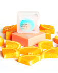 Beauty shot of Cocofloss Cara Cara Orange Floss 32 yards with orange slices