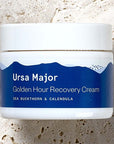 Ursa Major Golden Hour Recovery Cream (1.57 oz) shown top view on stone surface