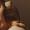 Lifestyle shot of Parfums Andre Gas Ensoleille moi Eau de Parfum - 100 ml on the shoulder of model