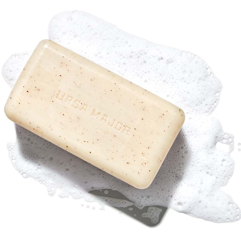 Ursa Major Morning Mojo Bar Soap (5 oz) shown unwrapped and with soap suds behind the soap bar