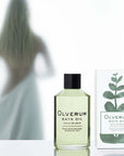 Olverum Bath Oil with box and woman silhouette in background