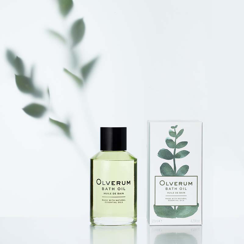 Olverum Bath Oil 125 ml with box and plant in background