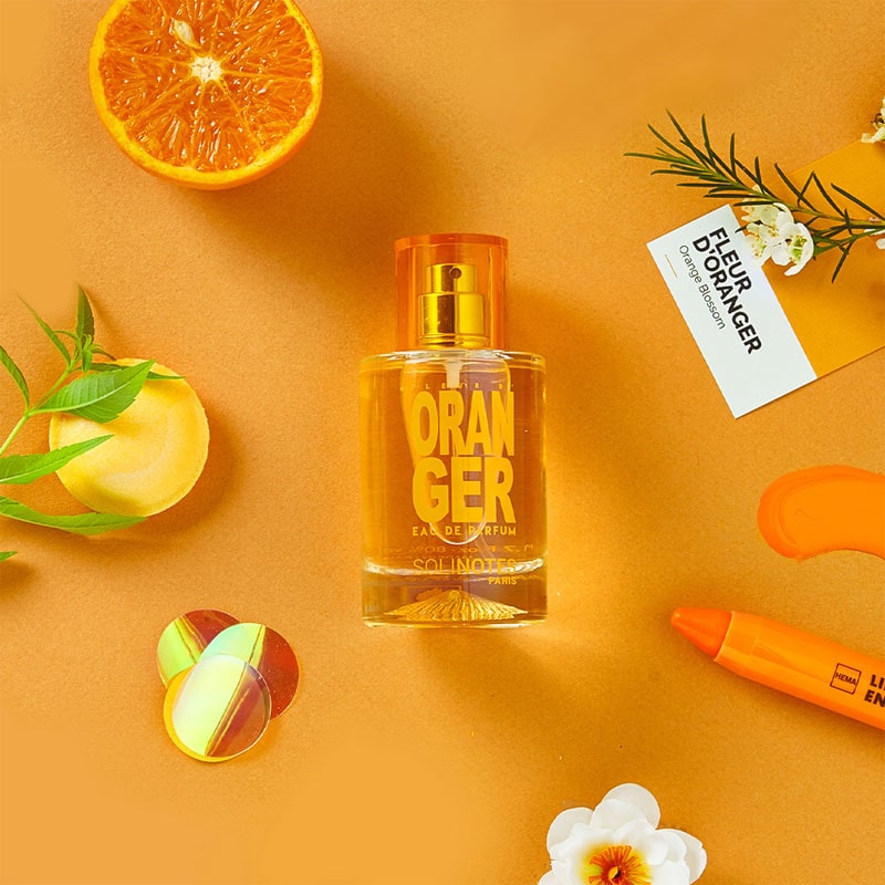 Solinotes Paris Fleur d'Oranger (Orange Blossom) Eau De Parfum - 50 ml beauty shot with orange and other items in background