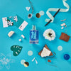 Solinotes Paris Tiare Eau De Parfum beauty shot on blue background with assorted items