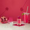 Lifestyle shot of Solinotes Paris Grenade (Pomegranate) Eau De Parfum - 50 ml with pomegranate in background