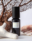 Penny Frances Apothecary Fleur de Lune Jasmine Perfume Oil Beauty Shot with seashell and coral