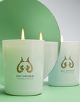 Eau d'Italie Scented Candle (190 g) shown burning with circle mirror in the background