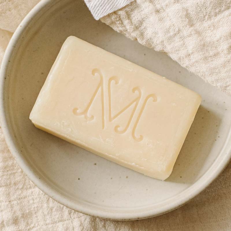 Minois Paris Savon Doux (Gentle Soap) (100 g) bar shown without outer wrapper on dish