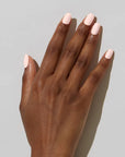 Model with dark skin tone wearing JINsoon Nail Lacquer - Pinky