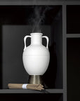 L'Objet Amphora Incense Holder on black shelf