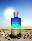 Juliette Has a Gun Vanilla Vibes Eau de Parfum on desert with sun behind it