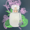 Les Parfums de Rosine Mon Amie La Rose Beauty Shot with purple and green color highlights