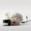 Penny Frances Apothecary Love Rosa A Rose Facial Balm Beauty shot with roses