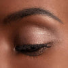 Chantecaille Luminescent Eye Shade - Giraffe shown on eyelid of model with dark skin