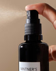 Lifestyle shot of Vintner's Daughter Active Treatment Essence showing spray dispensed from bottle