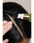 Rahua by Amazon Beauty Founder's Blend Scalp & Hair Treatment (38 ml) being applied to scalp