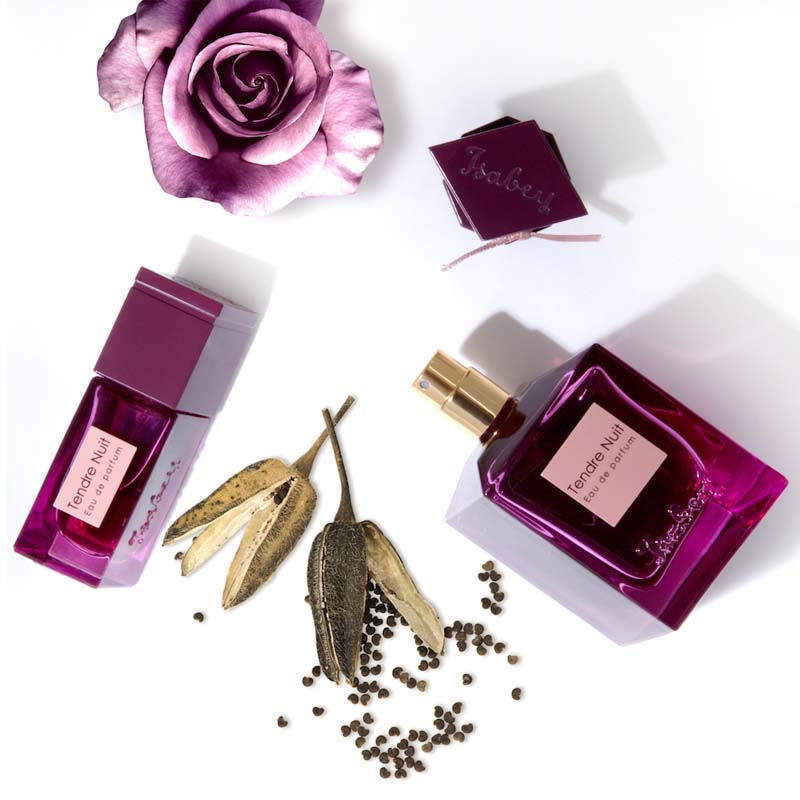 Isabey Paris Tendre Nuit Eau de Parfum beauty shot of 50 ml and 10 ml bottles together and purple rose in the background