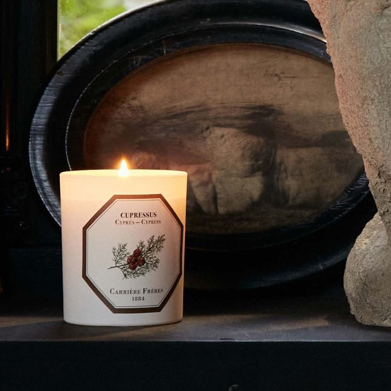 Lifestyle shot of Carriere Freres Cypress Candle (185 g) burning