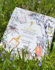 Rahua by Amazon Beauty Rahua Customizable Daily Hair Care Kit - beauty shot of box in grass with small flowers
